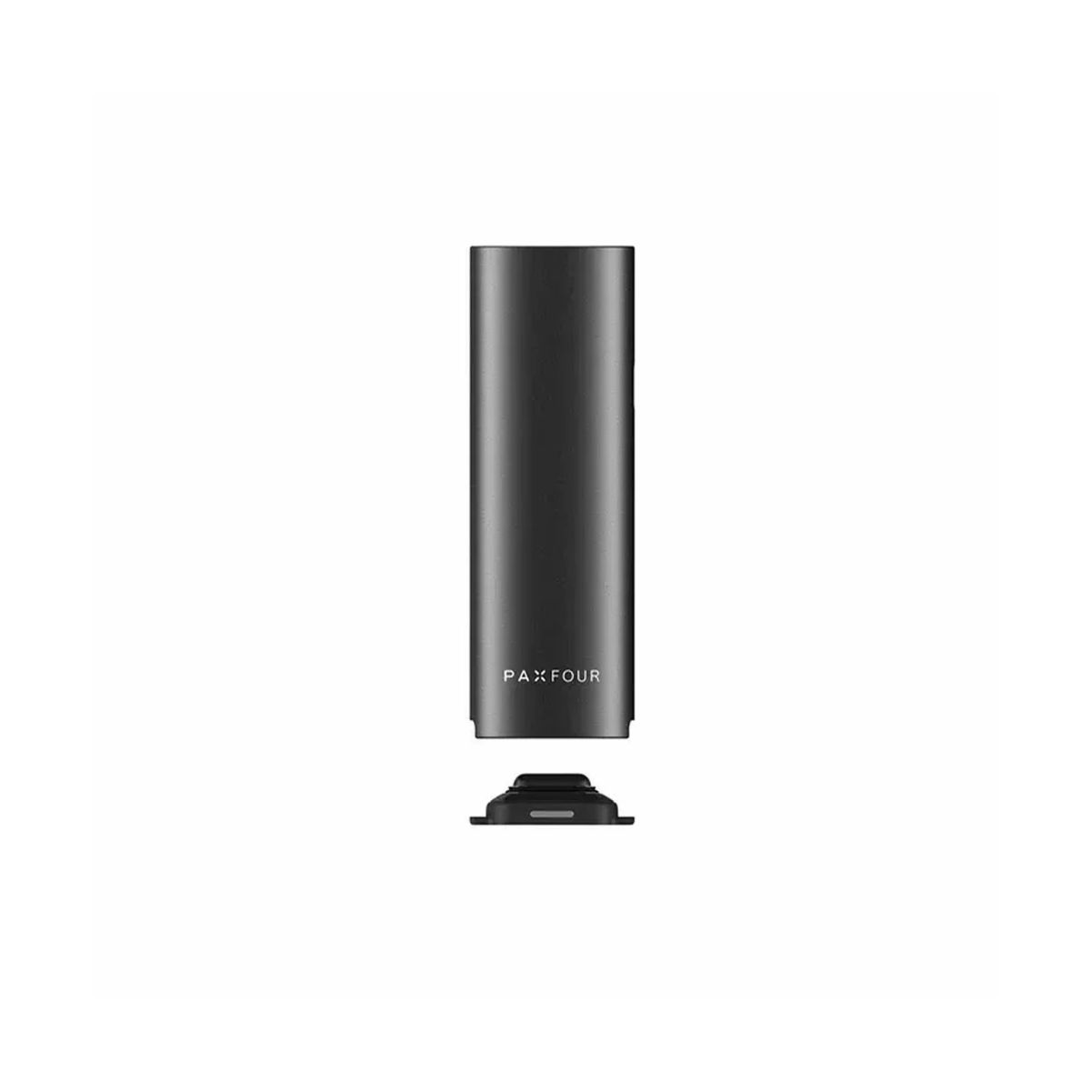 Black and green PAX 4 vaporizer resting on its magnetic charging dock